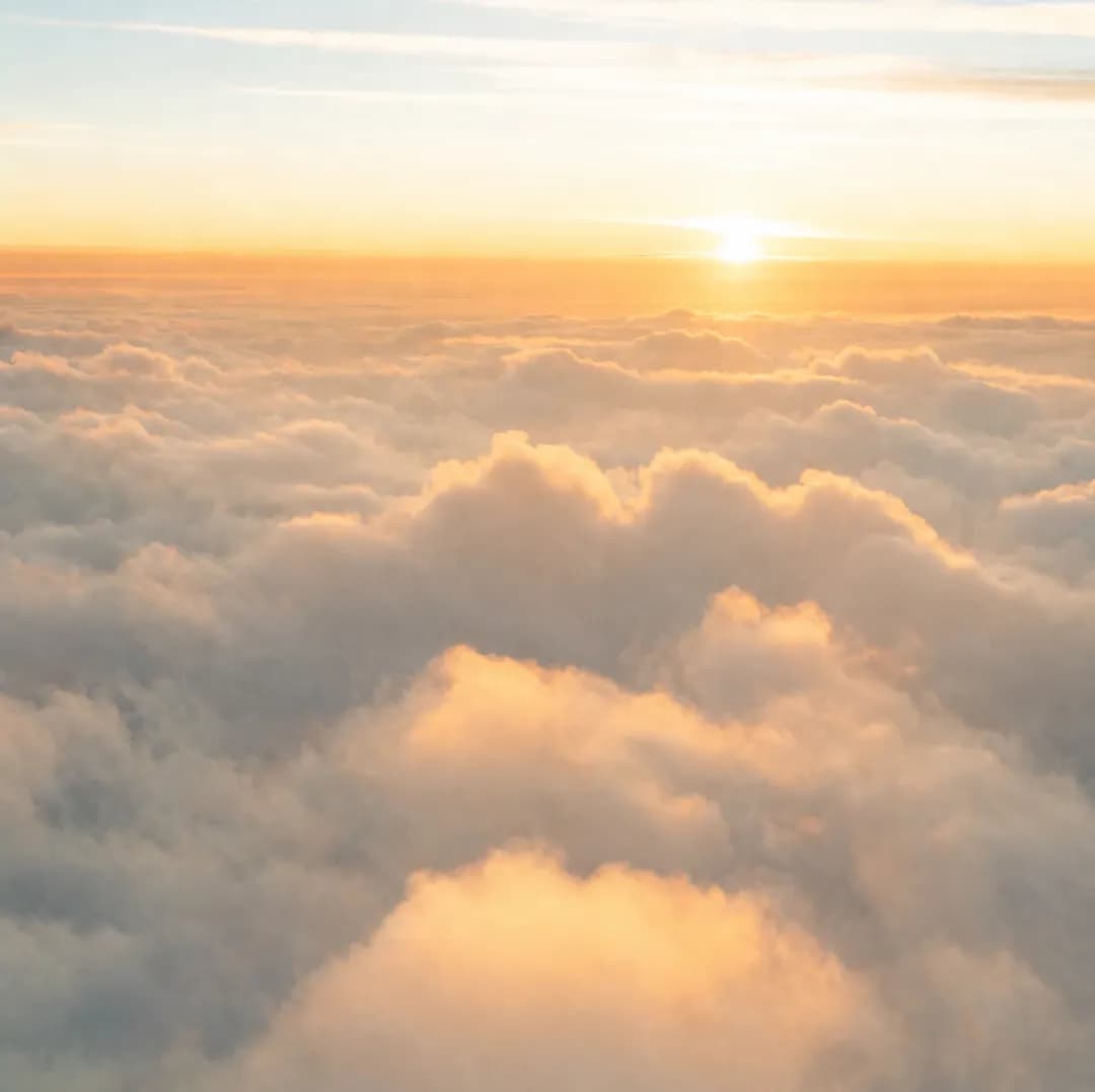 Clouds at sunset, with a phone on a call to Cocos Islands